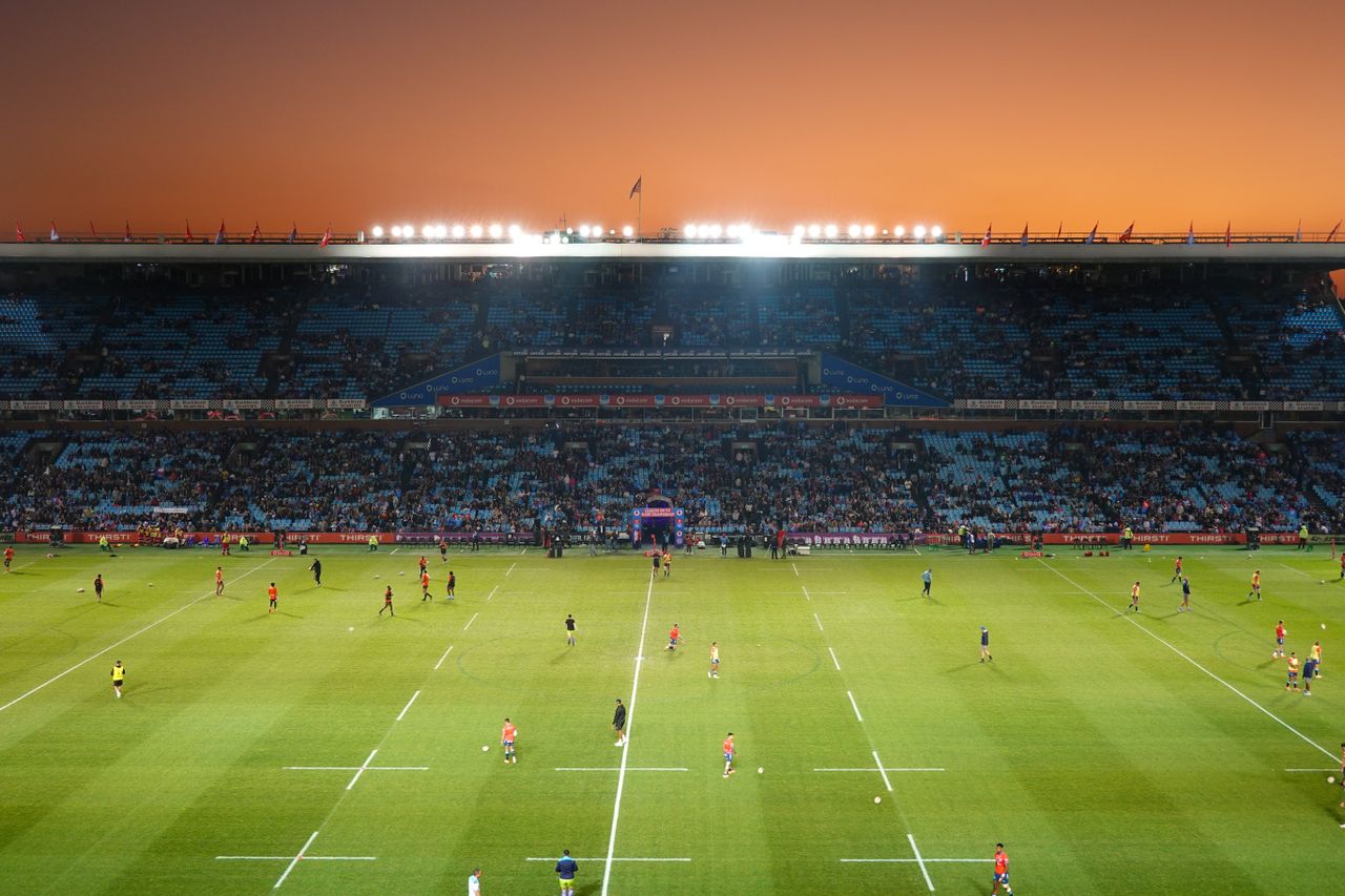 A rugby stadium at sunset